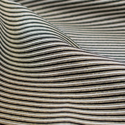 gorgeous silk ottoman suiting fabric by the yard. Featuring classic black and white horizontal stripe, enhanced by the subtle shimmer of gold metallic threads. Perfect for creating a formal gown, suiting, or a lovely lightweight coat to pair with that little black dress! Close up image.