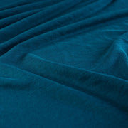 Italian Viscose Tissue Jersey designer deadstock fabric by the yard. Enjoy a bit of high-end designer British luxury! Casual, elegant, and soft, this tissue jersey has a lovely drape, thin hand, and is light and translucent. Perfect for a dress, loungewear, or T-Shirt or layering piece. Close up image.