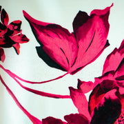 Italian Floral Silk satin designer deadstock fabric by the yard. Ready to create something gorgeous with our silk satin fabric of red and pink blooms highlighted by a bit of black for drama set against a white background. This thin woven silk from the Italian mills has a smooth satiny hand and just the right amount of flow! Image of fabric printing defect.