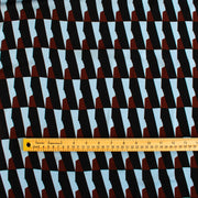 Italian Geometric Poly Satin designer deadstock fabric by the yard. From the Italian mills, a gorgeous satin with a modern palette of light blue, earthy brown and black that will elevate your next sewing project! Image of fabric scale.