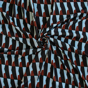 Italian Geometric Poly Satin designer deadstock fabric by the yard. From the Italian mills, a gorgeous satin with a modern palette of light blue, earthy brown and black that will elevate your next sewing project! Image of fabric fullness.
