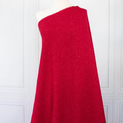 Italian Couture Red Melange YS1 Designer Boucle Virgin Wool fabric by the yard. Discreet luxury at its finest, this beautiful woolen boucle from an exclusive design house is the epitome of French elegance. Image of fabric on dressform.
