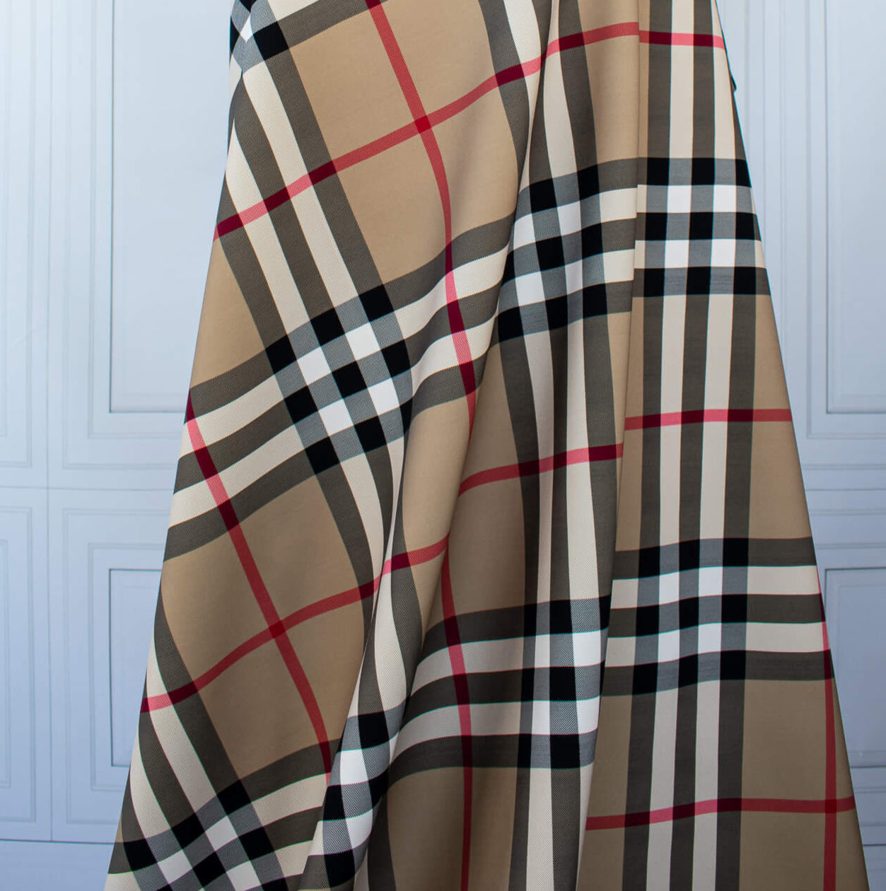 Couture British Designer Plaid Scuba Knit designer deadstock fabric by the yard. Bring on that London Style, in a classic plaid with a bit of a twist...it's scuba! Image of fabric drape.