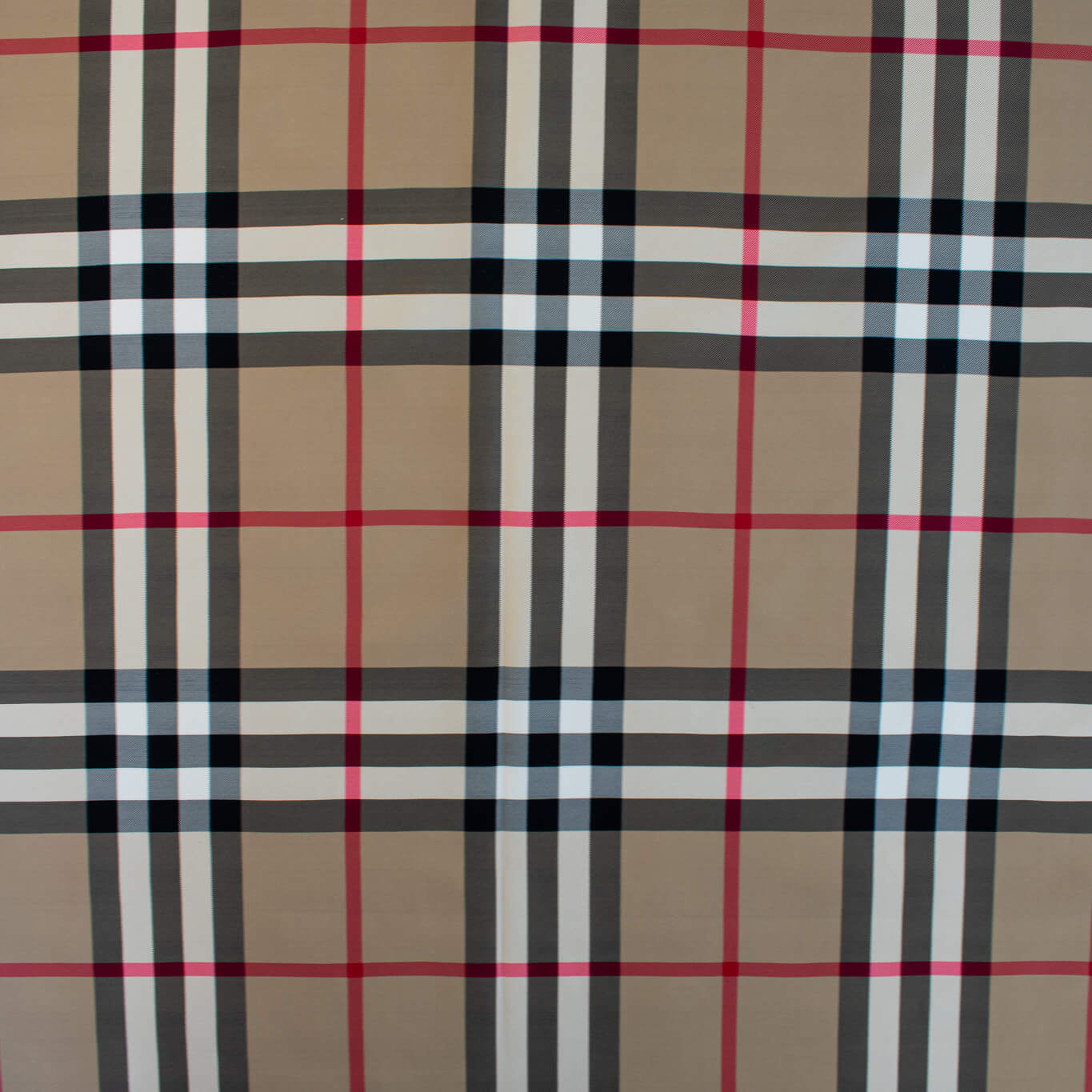Couture British Designer Plaid Scuba Knit designer deadstock fabric by the yard. Bring on that London Style, in a classic plaid with a bit of a twist...it's scuba! Image of fabric design.