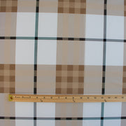 Couture British Designer Plaid Knit designer deadstock fabric by the yard. Bring on that London Style, in a knit! If you are looking to sew up some resort pieces this season then this is your knit. The cool sleek hand and drape of this fabric is perfect for swimwear, coverups, tops and cute dresses and skirts. Image of fabric design scale with ruler.