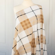 Couture British Designer Plaid Knit designer deadstock fabric by the yard. Bring on that London Style, in a knit! If you are looking to sew up some resort pieces this season then this is your knit. The cool sleek hand and drape of this fabric is perfect for swimwear, coverups, tops and cute dresses and skirts. Image of fabric draped on dressform.