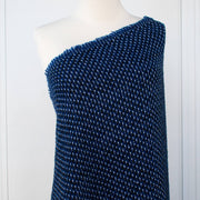 This is a lovely wool boucle fabric by the yard imported from Italy.  Dress it up or down, you will love the softness.  It has a nice hand and soft drape, ideal for your ClassicFrench Jacket with a fantastic selvedge! Image of fabric draped on dressform.