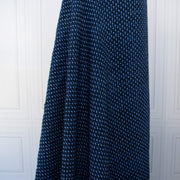 This is a lovely wool boucle fabric by the yard imported from Italy. Dress it up or down, you will love the softness. It has a nice hand and soft drape, ideal for your ClassicFrench Jacket with a fantastic selvedge!
Image of fabric drape.