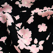 Couture Italian Viscose Floral Jacquard - 'All My Heart'! This stunning designer deadstock fabric by the yard features a gorgeous black base with delicate pink florals and ivory accents. Plus, playful and trending jacquard hearts add a touch of whimsy. 
Featuring a nice drape that falls away from the body and slightly textured hand, you'll find this fabric is perfect for formal attire or a little something special.  Close up image.