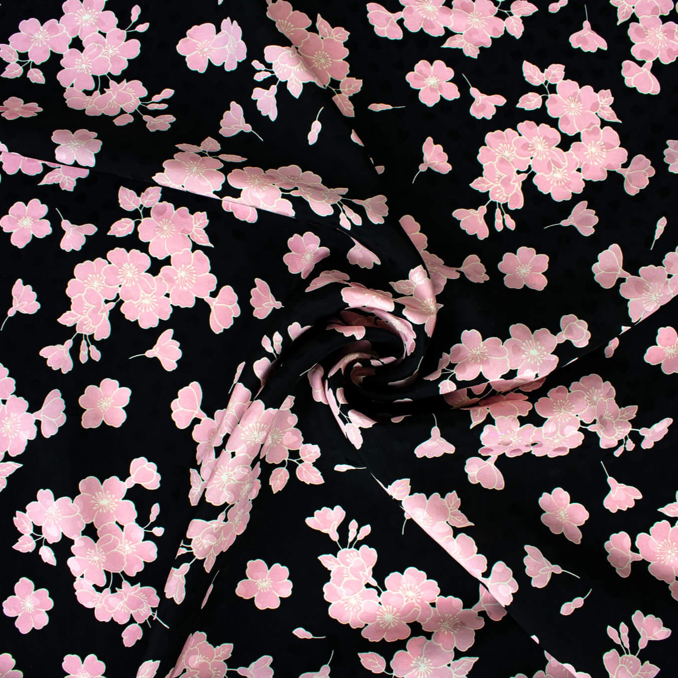 Couture Italian Viscose Floral Jacquard - 'All My Heart'! This stunning designer deadstock fabric by the yard features a gorgeous black base with delicate pink florals and ivory accents. Plus, playful and trending jacquard hearts add a touch of whimsy. 
Featuring a nice drape that falls away from the body and slightly textured hand, you'll find this fabric is perfect for formal attire or a little something special.  Image of fabric fullness.