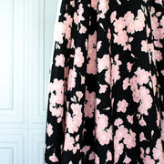 Couture Italian Viscose Floral Jacquard - 'All My Heart'! This stunning designer deadstock fabric by the yard features a gorgeous black base with delicate pink florals and ivory accents. Plus, playful and trending jacquard hearts add a touch of whimsy. 
Featuring a nice drape that falls away from the body and slightly textured hand, you'll find this fabric is perfect for formal attire or a little something special.  Image of fabric drape.