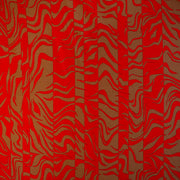 Italian Single Viscose Jersey Red and Caramel Modern Print fabric by the yard. A gorgeous vibrant knit that is sure to capture compliments. We love this combination of red and caramel brown tones in this modern jersey knit fabric. The printed design has a bit of animal print edge in a stripe like pattern.  Image of pattern design.