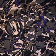 Italian Modern Floral Single Jersey Wool blend fabric by the yard. Gorgeous modern floral print perfect for transitioning to warmer months. This wool blend jersey in shades of brown, light pink, purple and black has a soft hand a beautiful drape. Whether you are creating a T-shirt or something a bit fancier, you're going to love how this fabric feels against your skin. Image of fabric design.