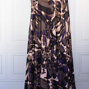 Italian Modern Floral Single Jersey Wool blend fabric by the yard. Gorgeous modern floral print perfect for transitioning to warmer months. This wool blend jersey in shades of brown, light pink, purple and black has a soft hand a beautiful drape. Whether you are creating a T-shirt or something a bit fancier, you're going to love how this fabric feels against your skin. Image of fabric drape.