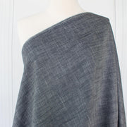 Stay cool and look amazing while you enjoy the breathability and sustainability of Tencel and all you love about linen in one gorgeous dark indigo fabric.   On the lighter side of a mid-weight with a beautiful sheen, nice drape, and softly textured hand you'll look 'Tres Chic'!  Image of fabric draped on dressform.