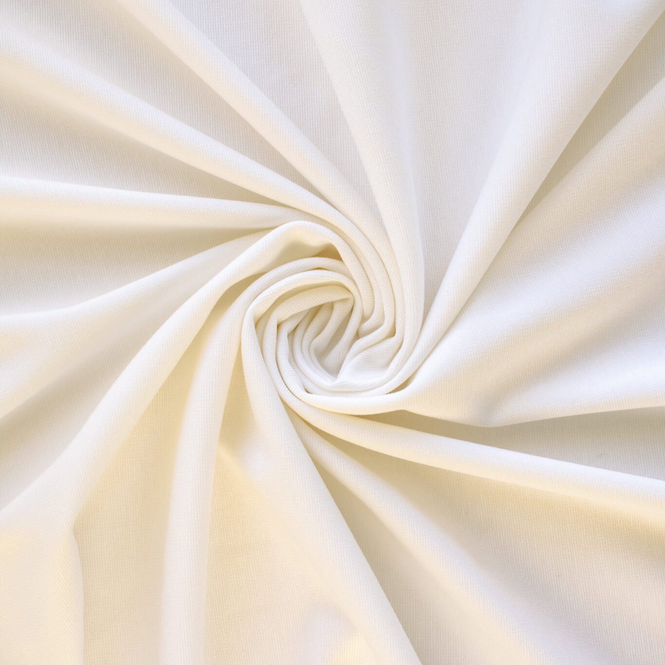 High-End Designer Pearl White Ponte Knit fabric by the yard. This Los Angeles designer has a knack for finding quality fabrics. This designer deadstock Ponte is soft with a nice drape that falls moderately close to the body. You'll fall in love with the comfort! Image of fabric fullness.