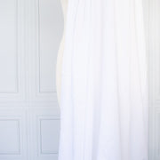High-End Designer White Cotton Fine Twill fabric by the yard. Simple elegance at its finest from a Los Angeles designer that has a knack for finding luxurious fabrics. Image of fabric drape.