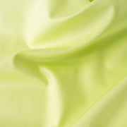 Have some fun in this delightful soft lime green cotton sateen fabric by the yard. Perfect when you want to add a bit of pizzazz to your outfit. The soft lightly brushed hand with the slightest sheen would sew up a lovely shirtdress,  jacket or ankle length pant! Close up image
