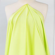 Have some fun in this delightful soft lime green cotton sateen fabric by the yard. Perfect when you want to add a bit of pizzazz to your outfit. The soft lightly brushed hand with the slightest sheen would sew up a lovely shirtdress,  jacket or ankle length pant! Image of fabric drape.