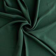 100% Silk Crepe de Chine fabric by the yard in Fern Green. Soft and fluid, this semi-textured fabric offers a beautiful drape and the luxury of silk. Image of fabric fullness.