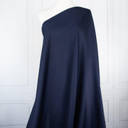Fine Egyptian Pima Cotton Pique Shirting fabric by the yard. Imported from Switzerland, our fabric boasts a luxurious cotton that is semi-sheer and has a soft, semi-crisp hand. Perfect for a high-end and comfortable shirt, dress, skirt or top! Image of fabric draped on dressform.