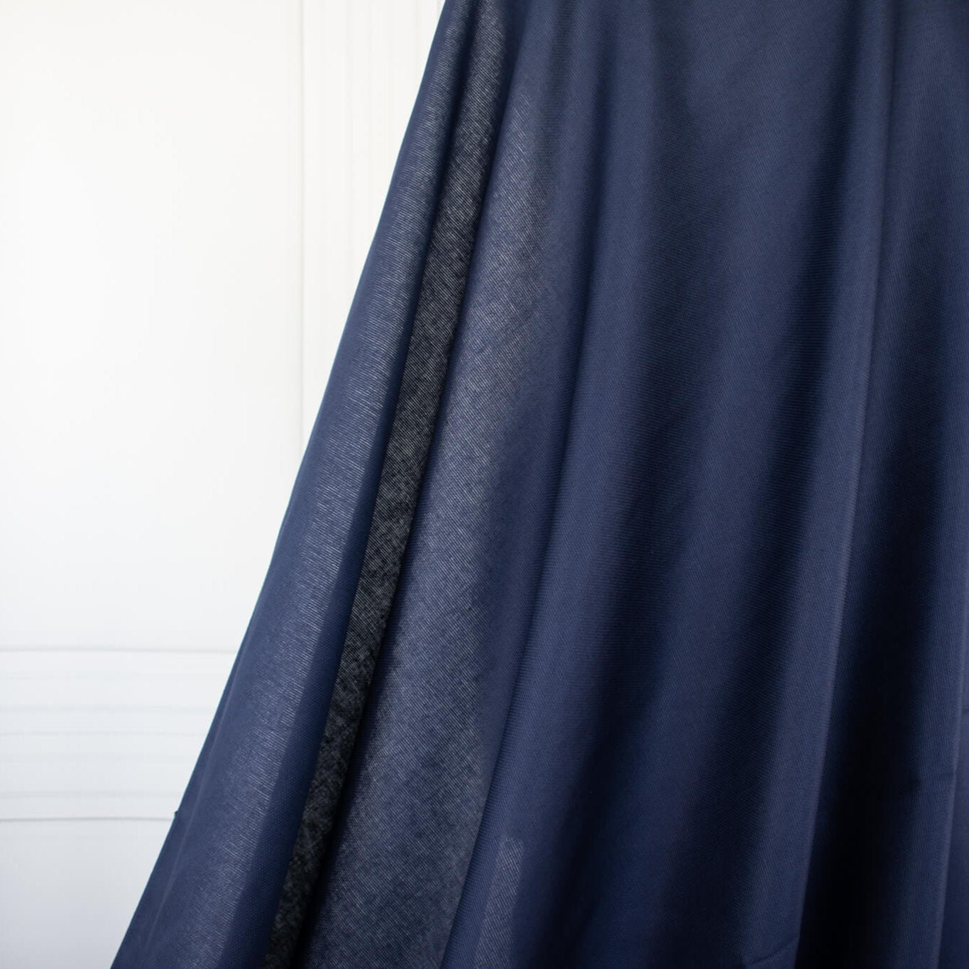 Fine Egyptian Pima Cotton Pique Shirting fabric by the yard. Imported from Switzerland, our fabric boasts a luxurious cotton that is semi-sheer and has a soft, semi-crisp hand. Perfect for a high-end and comfortable shirt, dress, skirt or top!  Image of fabric drape.