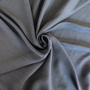 NYC Designer Deadstock Cotton Voile fabric by the yard. Amazingly soft and silky, this Navy/White horizontal stripe voile is lightweight with a thin hand, a must for warmer temperatures. Image of fabric fullness.
