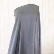 NYC Designer Deadstock Cotton Voile fabric by the yard. Amazingly soft and silky, this Navy/White horizontal stripe voile is lightweight with a thin hand, a must for warmer temperatures. Image of fabric draped on dressform.