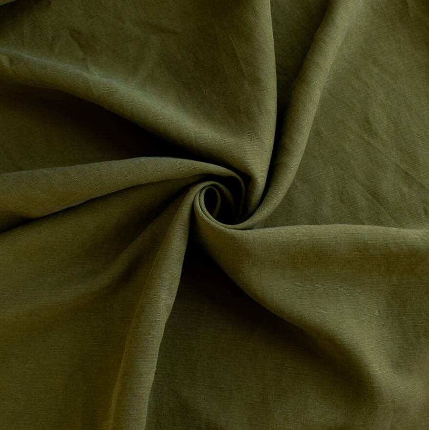 NYC Designer deadstock fabric by the yard. This linen and cotton blend shirting has such a lovely soft hand you'll absolutely love it. The fabric has a  supple drape, and leans towards a mid-weight. Image of fabric fullness.