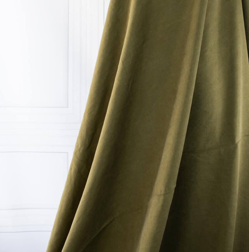 NYC Designer deadstock fabric by the yard. This linen and cotton blend shirting has such a lovely soft hand you'll absolutely love it. The fabric has a  supple drape, and leans towards a mid-weight. Image of fabric drape.