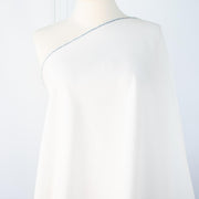 NYC Designer Linen blend designer deadstock fabric by the yard is the perfect fabric if you just love linen.  A plain weave off-white fabric with a soft, slightly crisp hand.  Image of draped fabric on dressform.