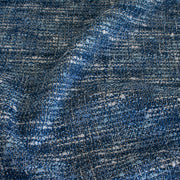 A beautifully soft NYC Designer Boucle suiting fabric by the yard that can be paired with sophisticated solids or your favorite denim. Varying shades of blue and alabaster yarns make this boucle extra special. Enjoy creating your next make with style and comfort. Image of fabric weave.