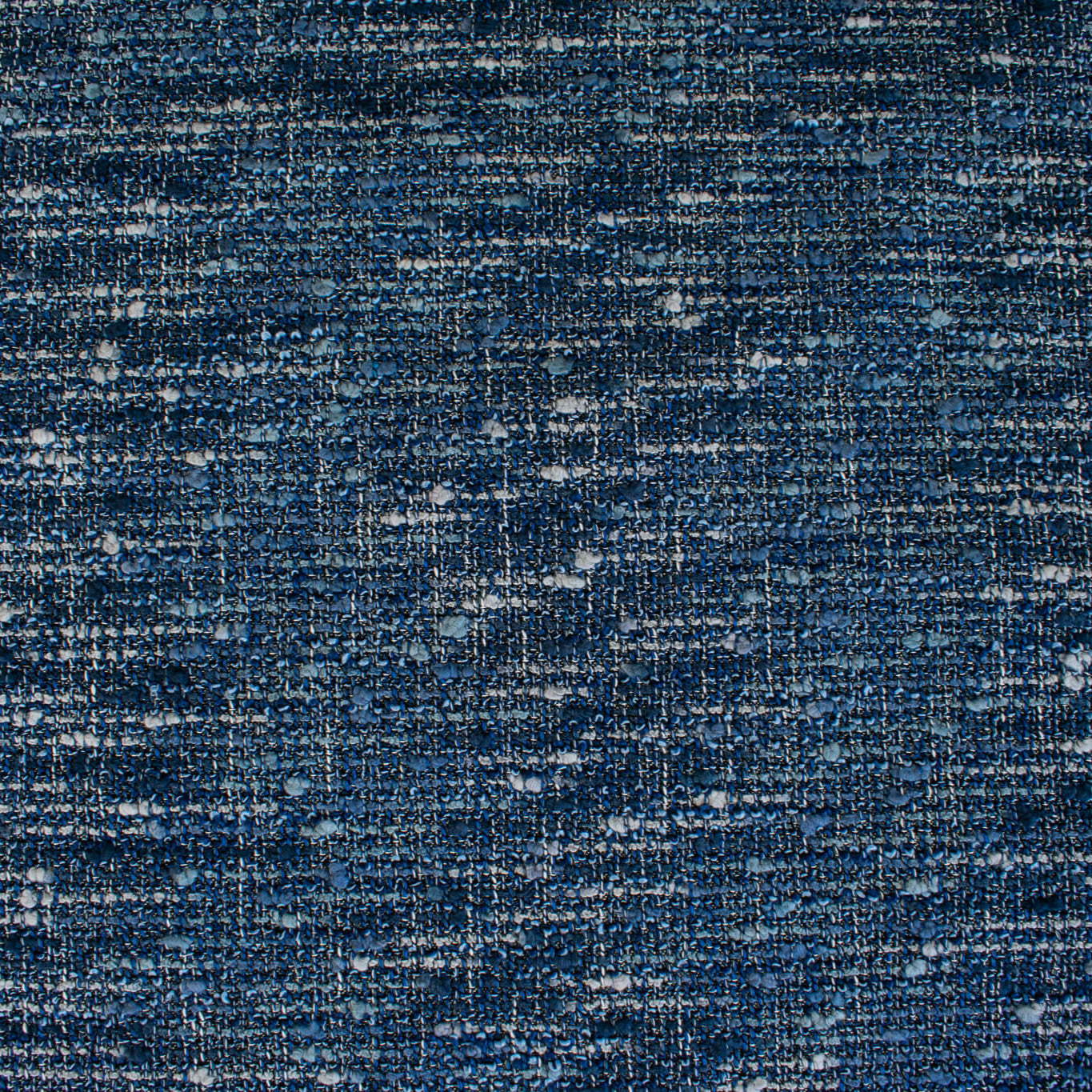 A beautifully soft NYC Designer Boucle suiting fabric by the yard that can be paired with sophisticated solids or your favorite denim. Varying shades of blue and alabaster yarns make this boucle extra special. Enjoy creating your next make with style and comfort. Image of overall fabric design.