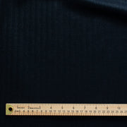 Image demonstrating scale of stripe pattern.  A gorgeous wool blend suiting from a Beverly Hills couture house is sure to add glamour to your outfit!  A soft textured hand with a herringbone stripe pattern that shimmers with silvery metallic threads. A perfect choice for a jacket, skirt, wide leg pant, or perhaps a coat dress.
