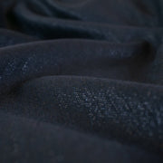 A gorgeous wool blend suiting from a Beverly Hills couture house is sure to add glamour to your outfit!  A soft textured hand with a herringbone stripe pattern that shimmers with silvery metallic threads. A perfect choice for a jacket, skirt, wide leg pant, or perhaps a coat dress.  Close up image.