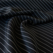 Gorgeous Couture Designer 4-Ply Silk Black with a white vertical double pinstripe, this premium medium weight silk has a soft sheen and gentle drape. A fine smooth hand feels buttery on the skin, perfect for a wide leg pant, vest, jacket or dress! Image of fabric.