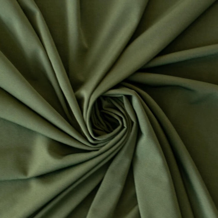 Designer ITY knit with a soft hand and fluid drape.  Perfect for wrap dresses or tops.  This knit has nice weight, it's light but it's not a slinky knit.  If you're just starting to work with ITY knits you will love how this sews up!  Image of fabric body.