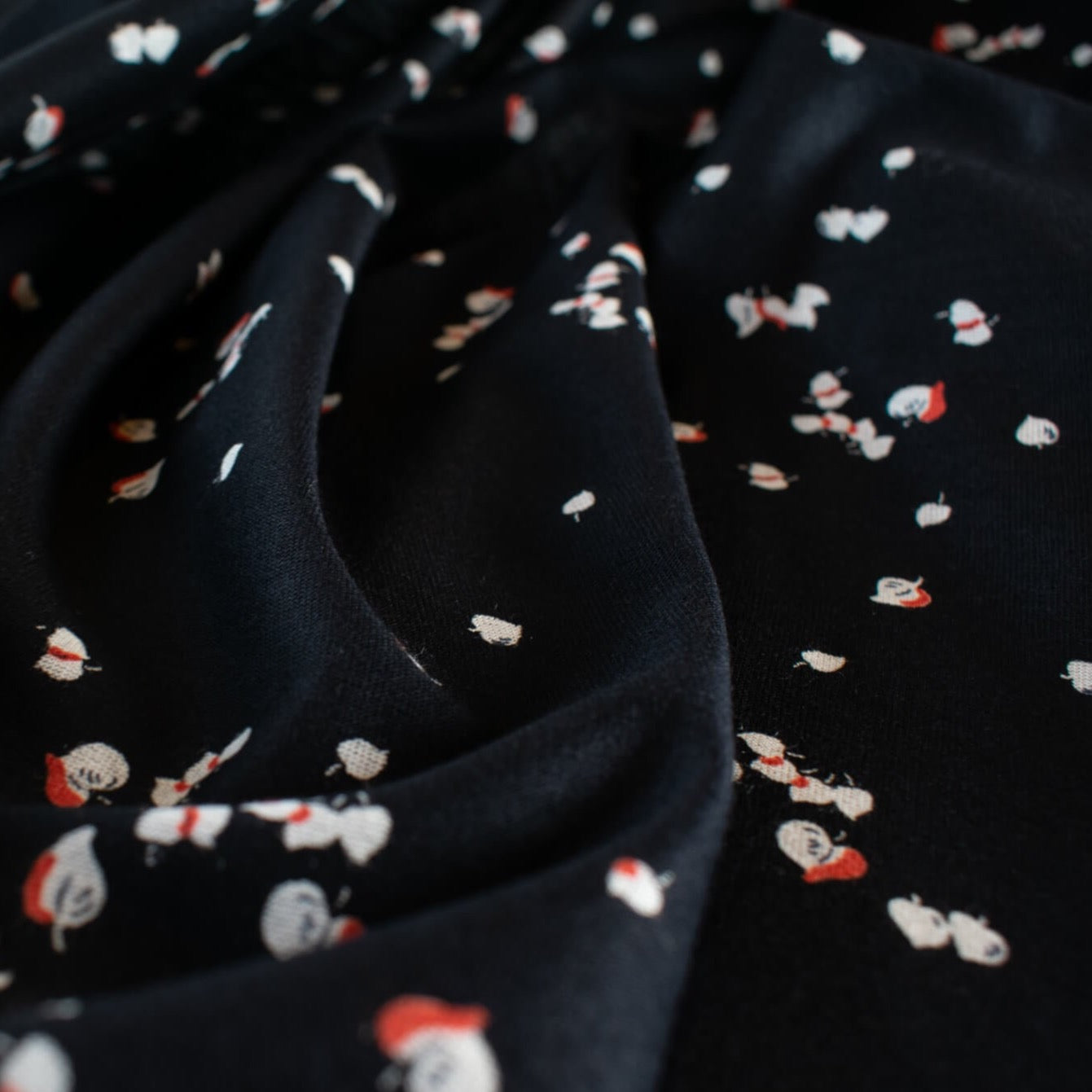 Silky soft cotton modal blend from the Italian mills.  Tiny leaves of red and light taupe fall against deep black in this luxurious jersey knit.  This fabric just feels good...the modal adds such an incredibly soft touch that this will be sure to become a favorite.   Create a striking top or take advantage of the beautiful drape of this fabric and whip up a Maxi dress!