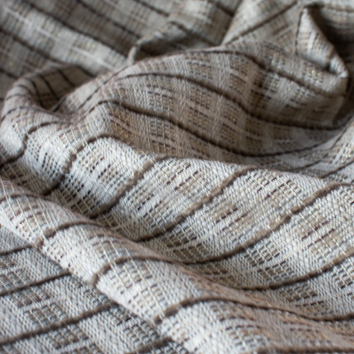 Designer Italian  suiting in a sophisticated plaid. Create an elegant piece in your wardrobe with this gorgeous three season fabric.