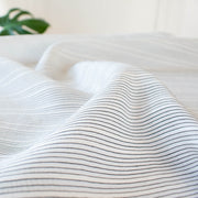 Light and airy Italian voile is soft and ohh so summery! Can you just picture yourself in a loose fitted unbuttoned shirtdress as a gorgeous layering piece over a cami and ankle length jeans.  This will definitely take your summer holiday up a notch!  Perfect for summer dresses, skirts and tops. The thin horizontal black stripes and bright white woven opaque stripes are set against a sheer white voile. For skirts and dresses we recommend an A-Line cut (won't those stripes look great on the bias) and lining.