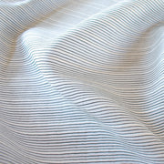 Light and airy Italian voile is soft and ohh so summery! Can you just picture yourself in a loose fitted unbuttoned shirtdress as a gorgeous layering piece over a cami and ankle length jeans. This will definitely take your summer holiday up a notch! Perfect for summer dresses, skirts and tops. The thin horizontal black stripes and bright white woven opaque stripes are set against a sheer white voile Close up image.