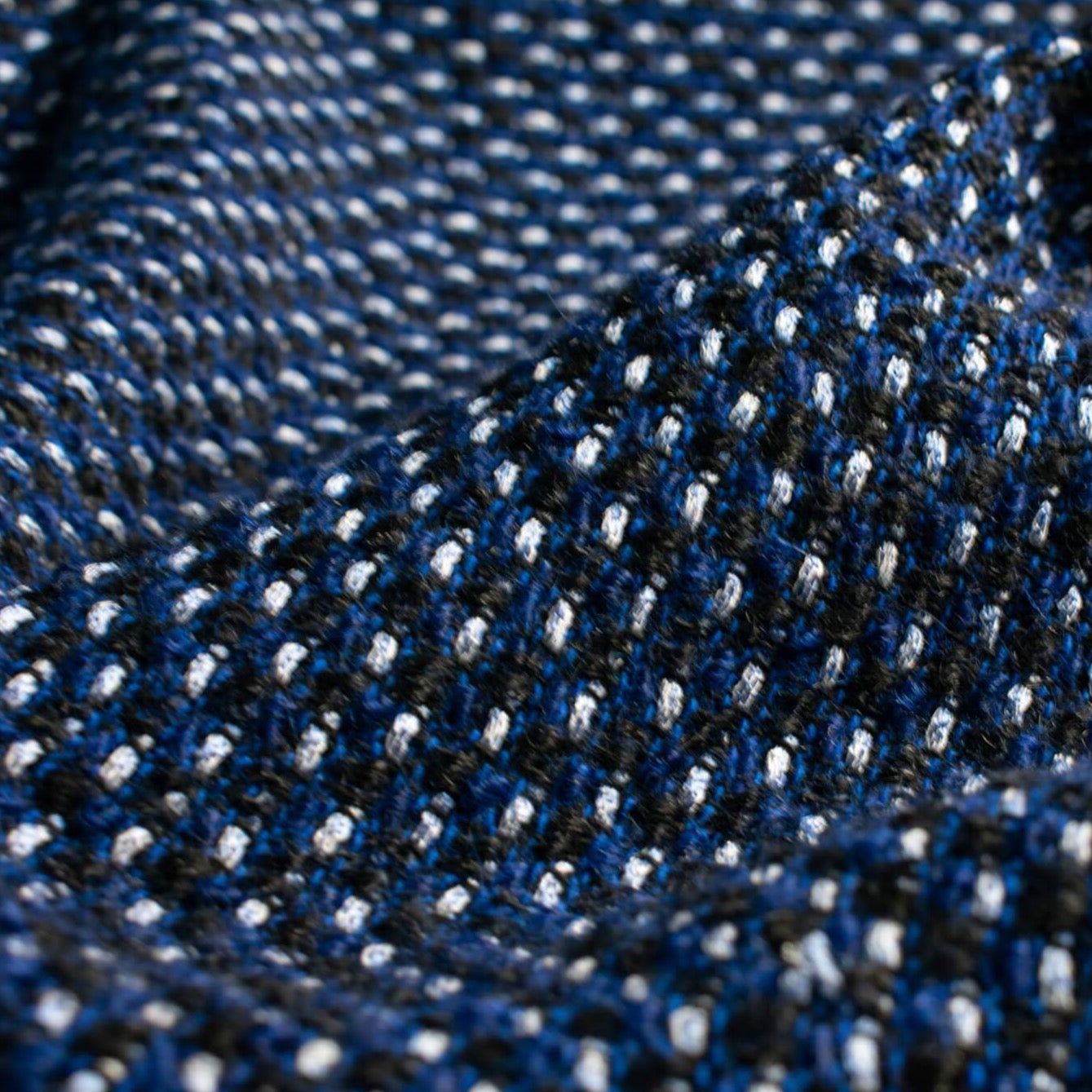 This is a lovely wool boucle imported from Italy. Dress it up or down you will love the softness. Ideal for you French Jacket with a fantastic selvedge! Close up photo of weave.