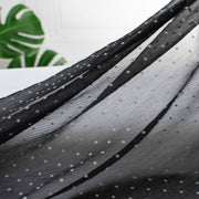 Classic black and off white polka dot is always elegant! Chiffon is sheer, has a beautiful drape and is popular in blouses, gowns, lingerie, flowy overlays, scarves, even trim. Perhaps you have seen it used as trim in those fabulous French Jackets! Photo highlights fabric drape and texture.