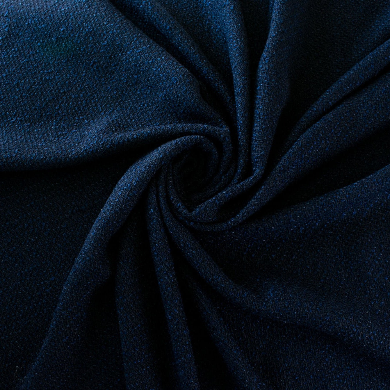 NY Designer boucle suiting with lovely strands of shimmering blue threads is a Classic French Jacket waiting to happen! This is a nice choice when you want something different than black but still want the drama and sophistication of a darker color. Image of fabric body.