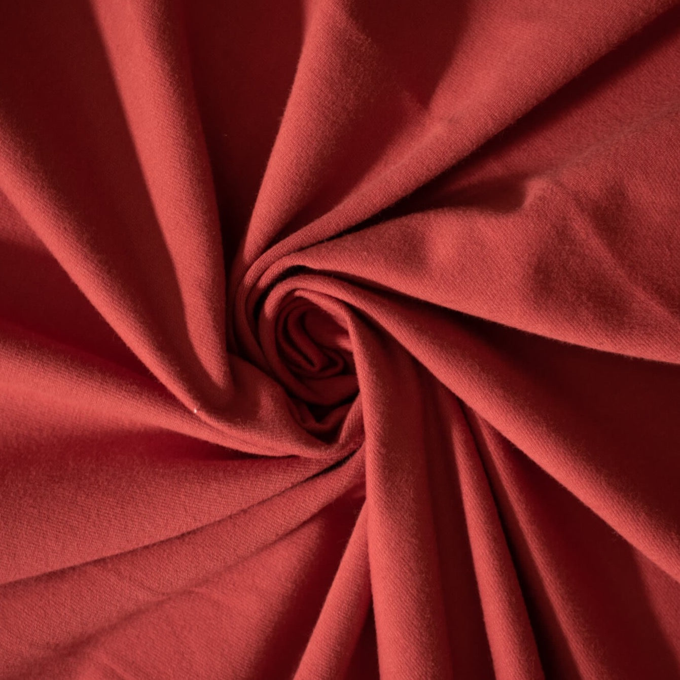 NY Designer cotton/lycra jersey in a warm scarlett red is super soft and super wide!  It is on the lighter side of a mid-weight and has excellent stretch and recovery. A cotton knit with lycra is perfect for sewing up a gorgeous top for warmer weather!