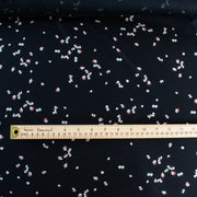 Silky soft cotton modal blend from the Italian mills.  Tiny leaves of red and light taupe fall against deep black in this luxurious jersey knit.  This fabric just feels good...the modal adds such an incredibly soft touch that this will be sure to become a favorite.   Create a striking top or take advantage of the beautiful drape of this fabric and whip up a Maxi dress!