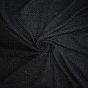 Designer Black Boucle fabric swirled to show fabric fullness.