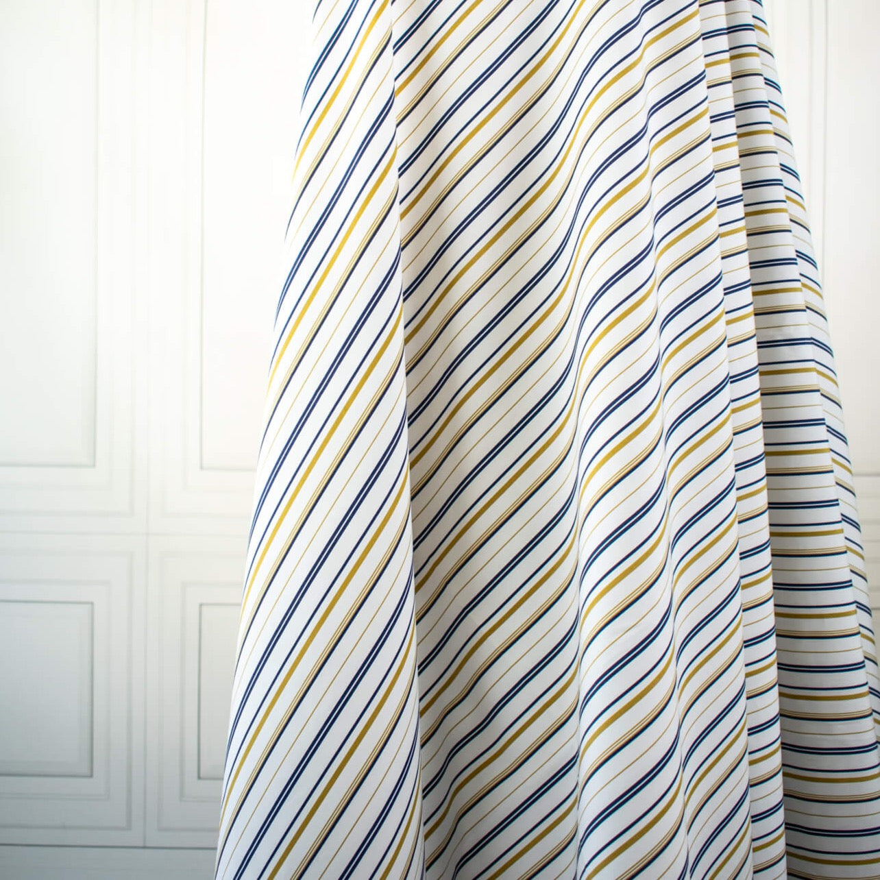 Bring effortless sophistication to your look with the 'Effortless' LA Designer Striped Cotton Shirting fabric by the yard. Crafted from luxurious 100% cotton, this designer shirting ensures you look on-trend with minimal effort! Image of fabric on dressform.