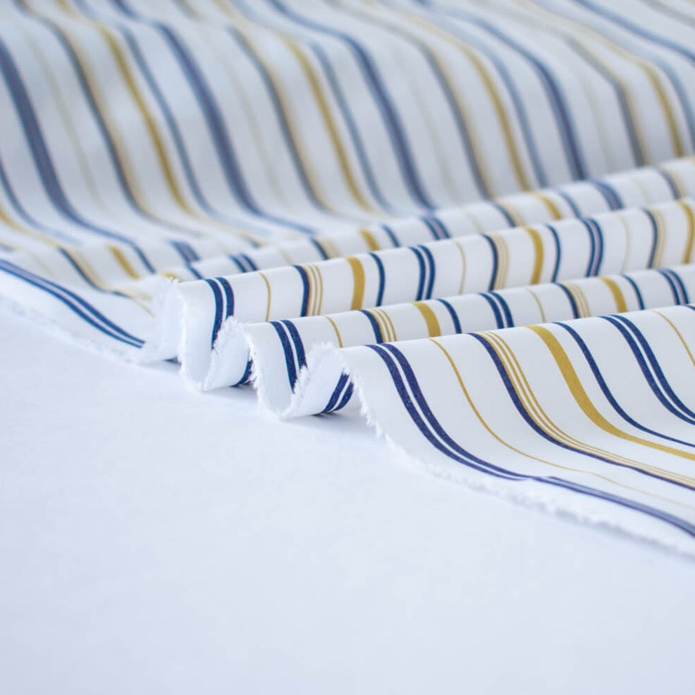 Bring effortless sophistication to your look with the 'Effortless' LA Designer Striped Cotton Shirting fabric by the yard. Crafted from luxurious 100% cotton, this designer shirting ensures you look on-trend with minimal effort! Image of fabric selvedge