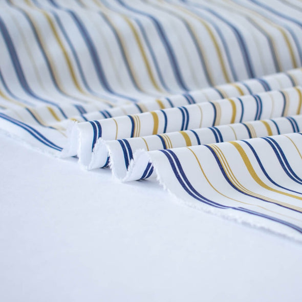 Bring effortless sophistication to your look with the 'Effortless' LA Designer Striped Cotton Shirting fabric by the yard. Crafted from luxurious 100% cotton, this designer shirting ensures you look on-trend with minimal effort! Image of fabric selvedge